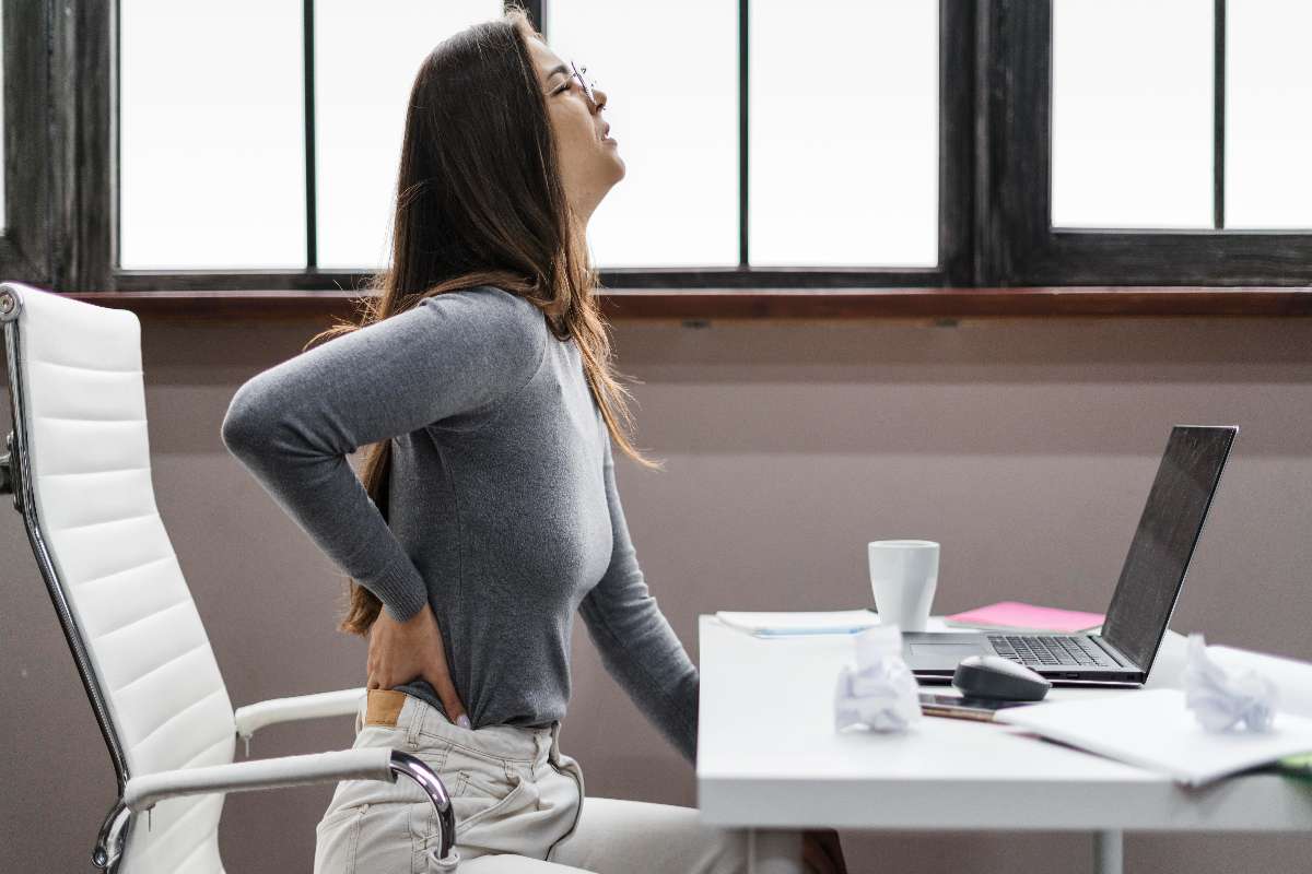 Women experiencing Back pain due to poor posture