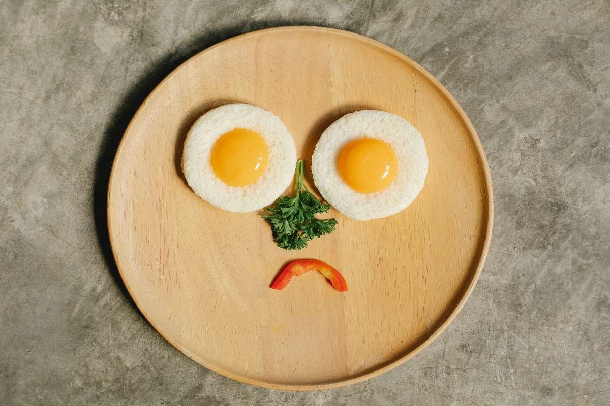 A sad face made out of food items depicting loss of appetite