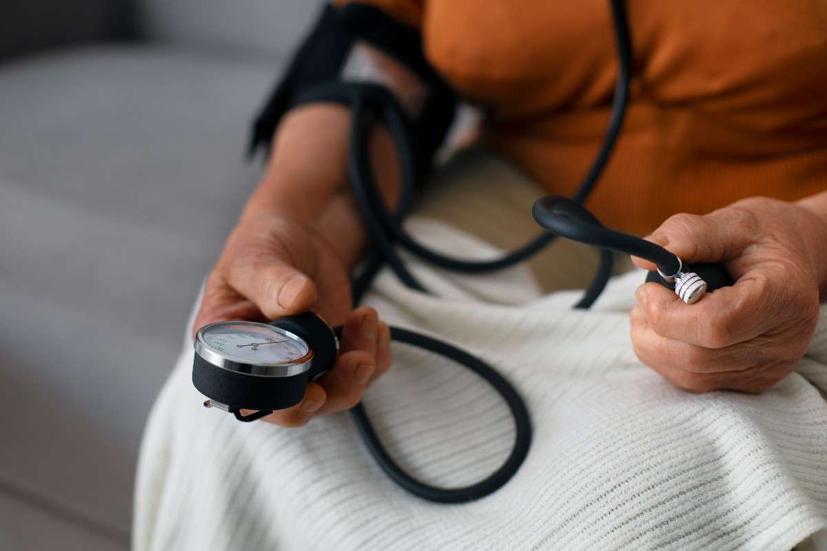 The person checking their Low blood pressure with a tensiometer